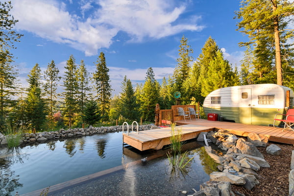 Natural swimming pond at Eagles Nest with the vintage camper